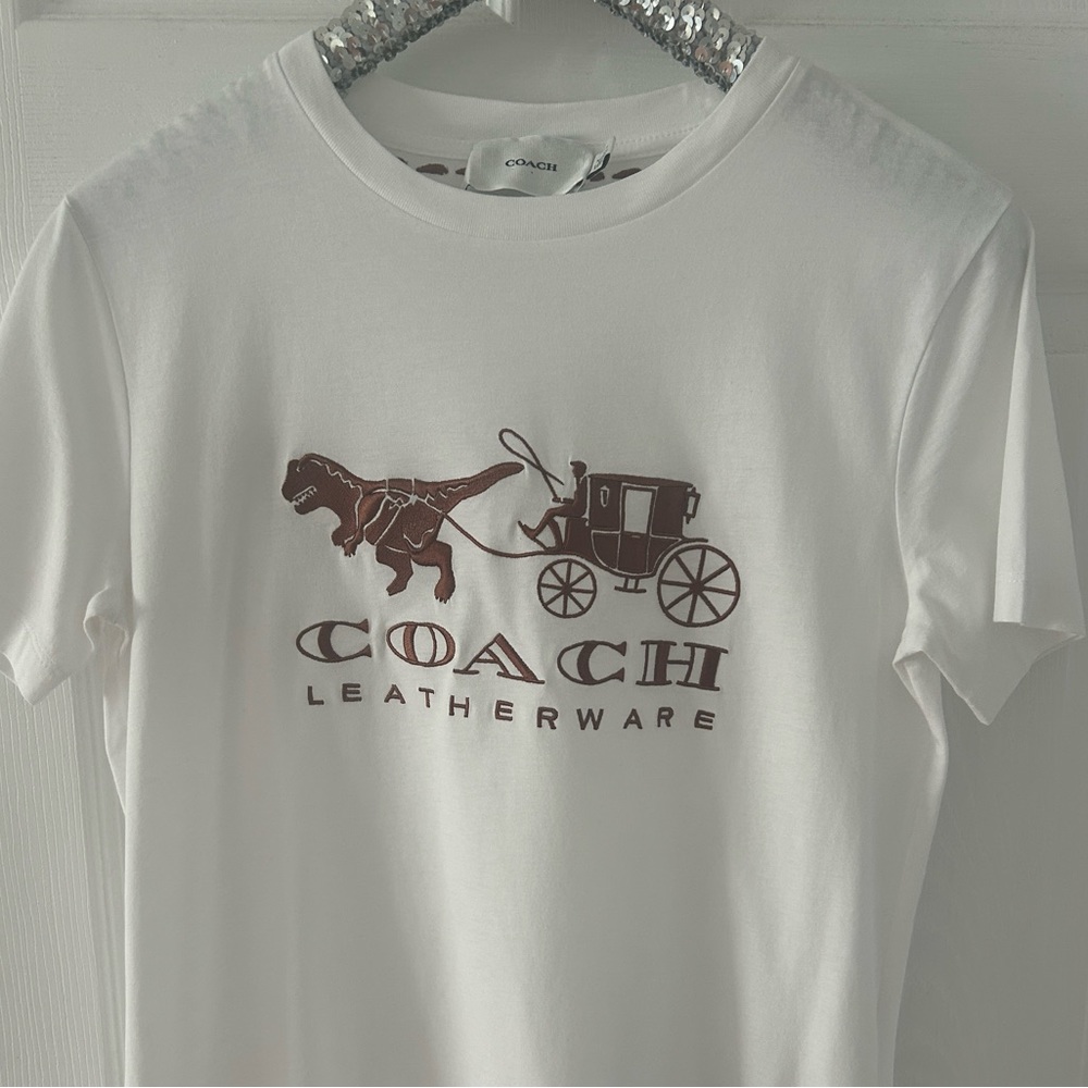 Coach embroidered tee shirt. White with brown logo featuring Rexy. Size Medium